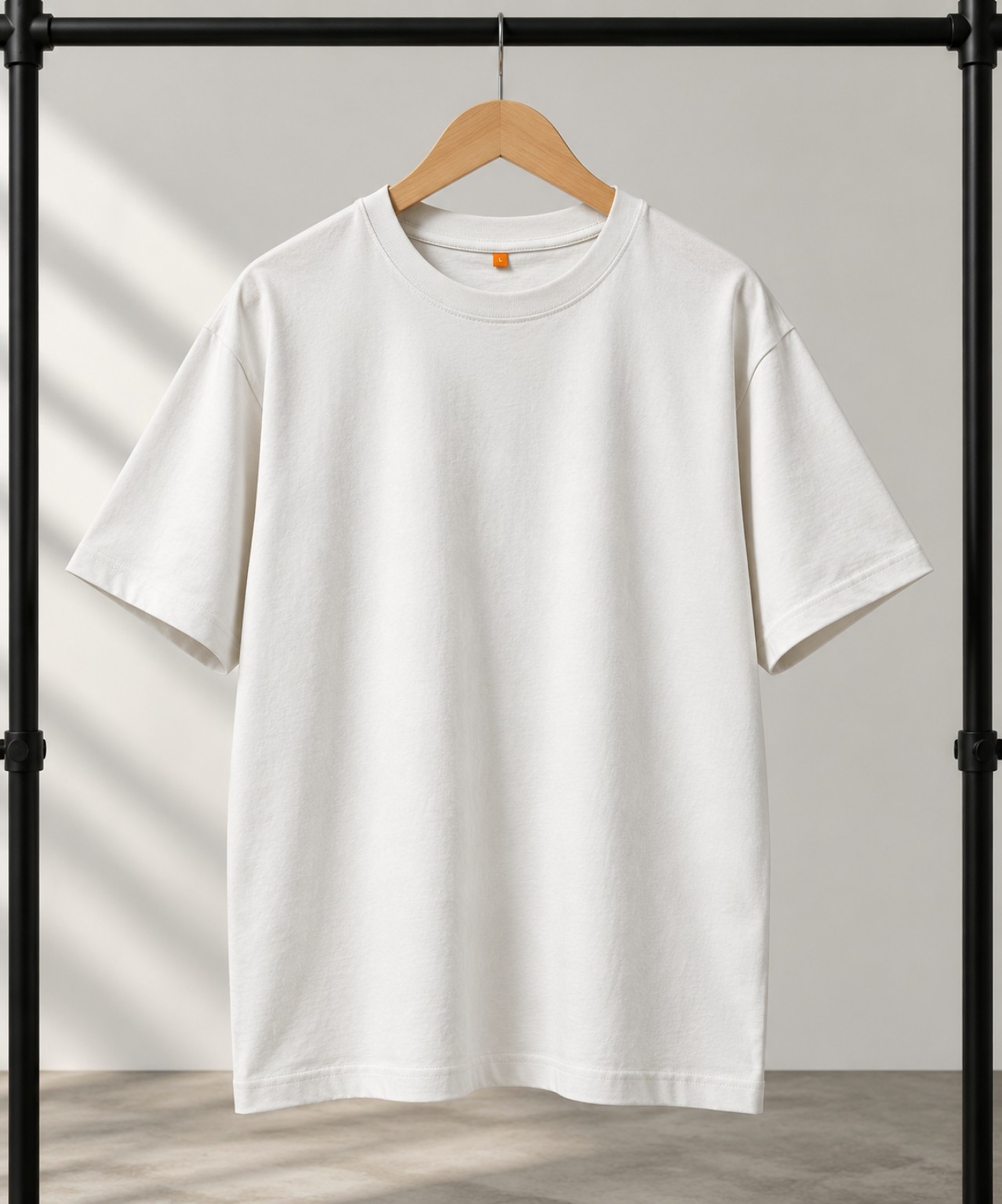 Green oversized t-shirt on a hanger