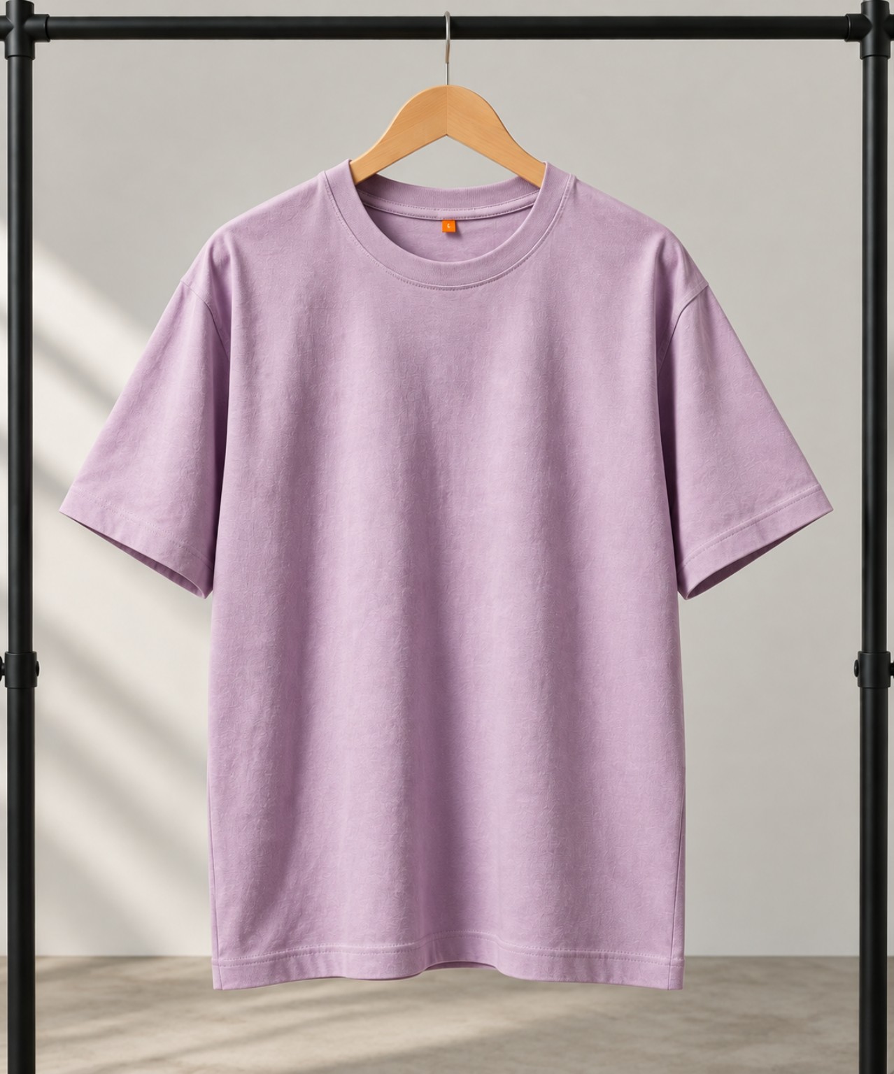 Lavender oversized t-shirt on a hanger